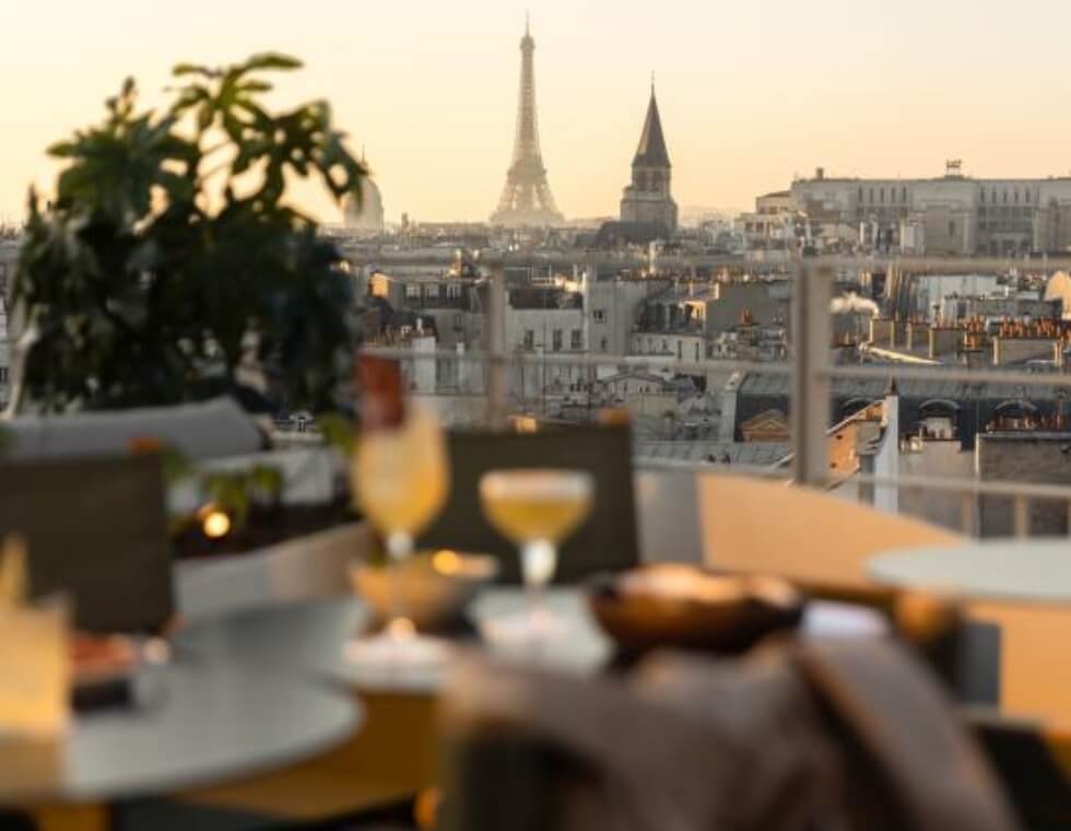 Sunset view of the Parisian skyline from Dame des Arts rooftop bar.