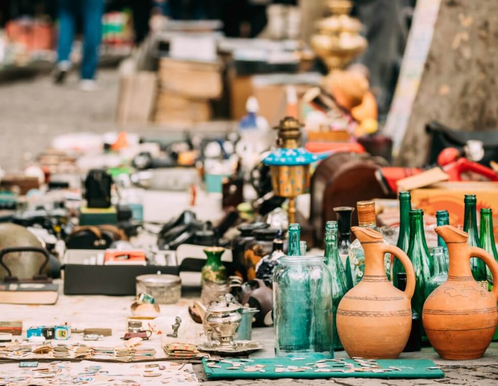 French antique ceramics, glassware, and coins, in Annecy brocante.