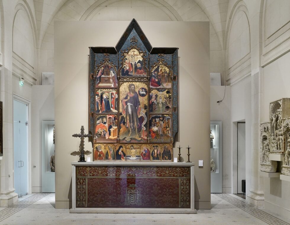 Historic religious altar decorated with painted motifs at the Museum of Decorative Arts, Paris, France.