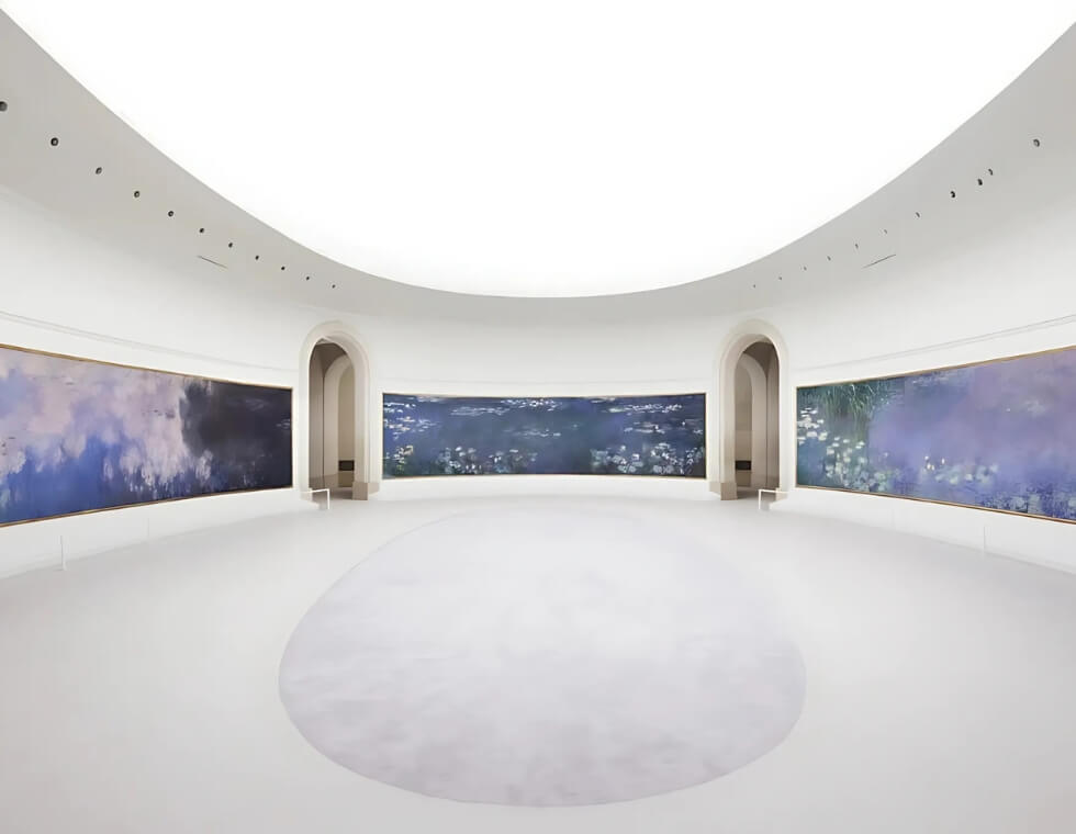 Interior of L'Orangerie Museum in Paris, France, featuring Monet’s panoramic Water Lily paintings