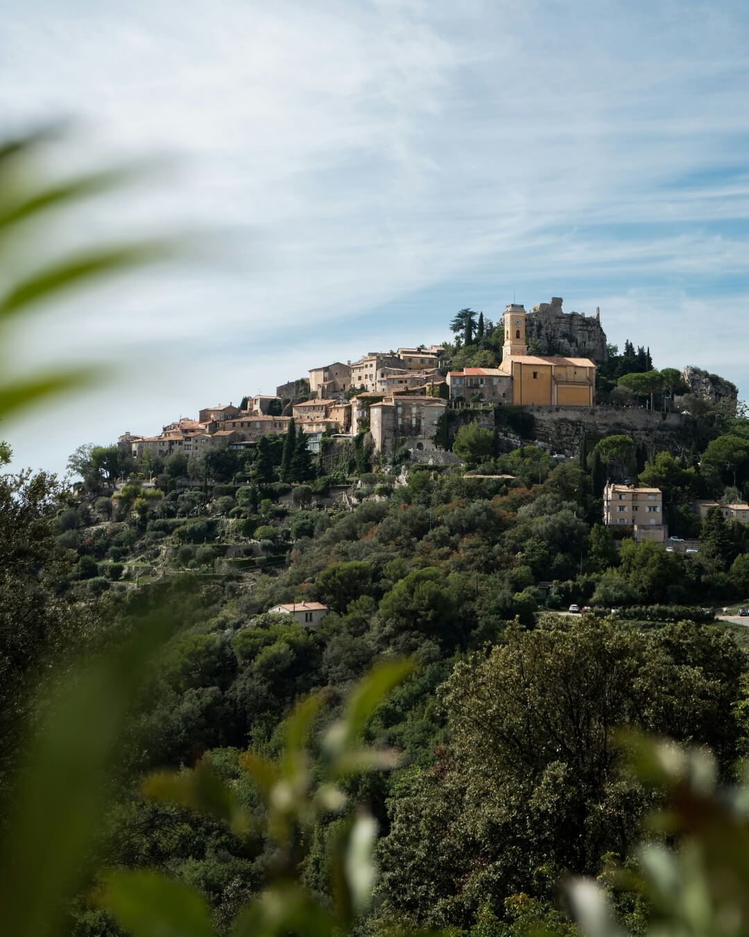 Historic French village in the French Riviera, surrounded by lush natural greenery.