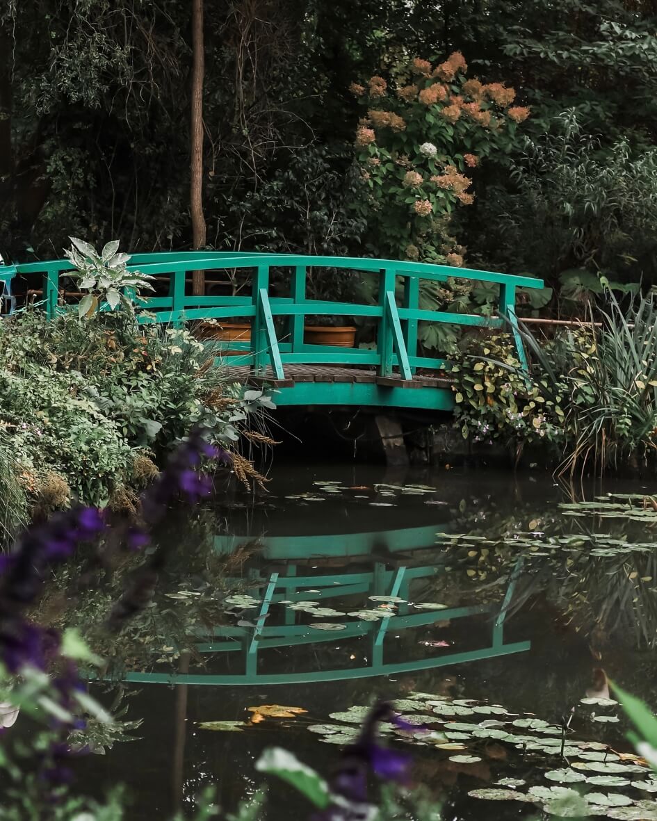 Claude Monet’s green garden bridge over the waterlily pond in Giverny, France.