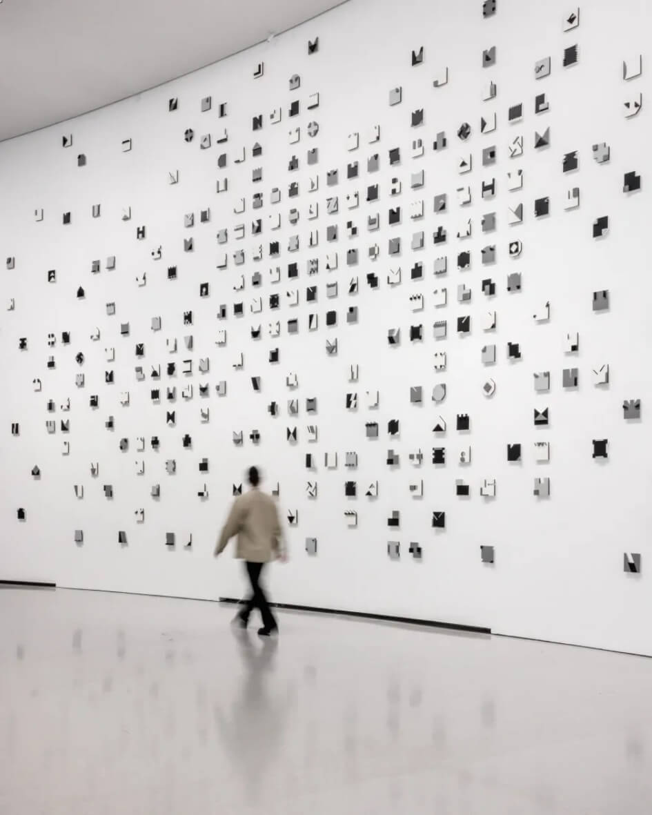 Bourse de Commerce exhibit in Paris, France featuring contemporary art and visitors.