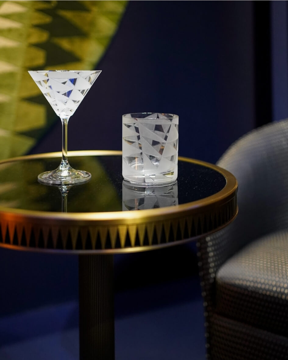 Frosted design whiskey and martini glasses on display at the Museum of Decorative Arts in Paris, France.