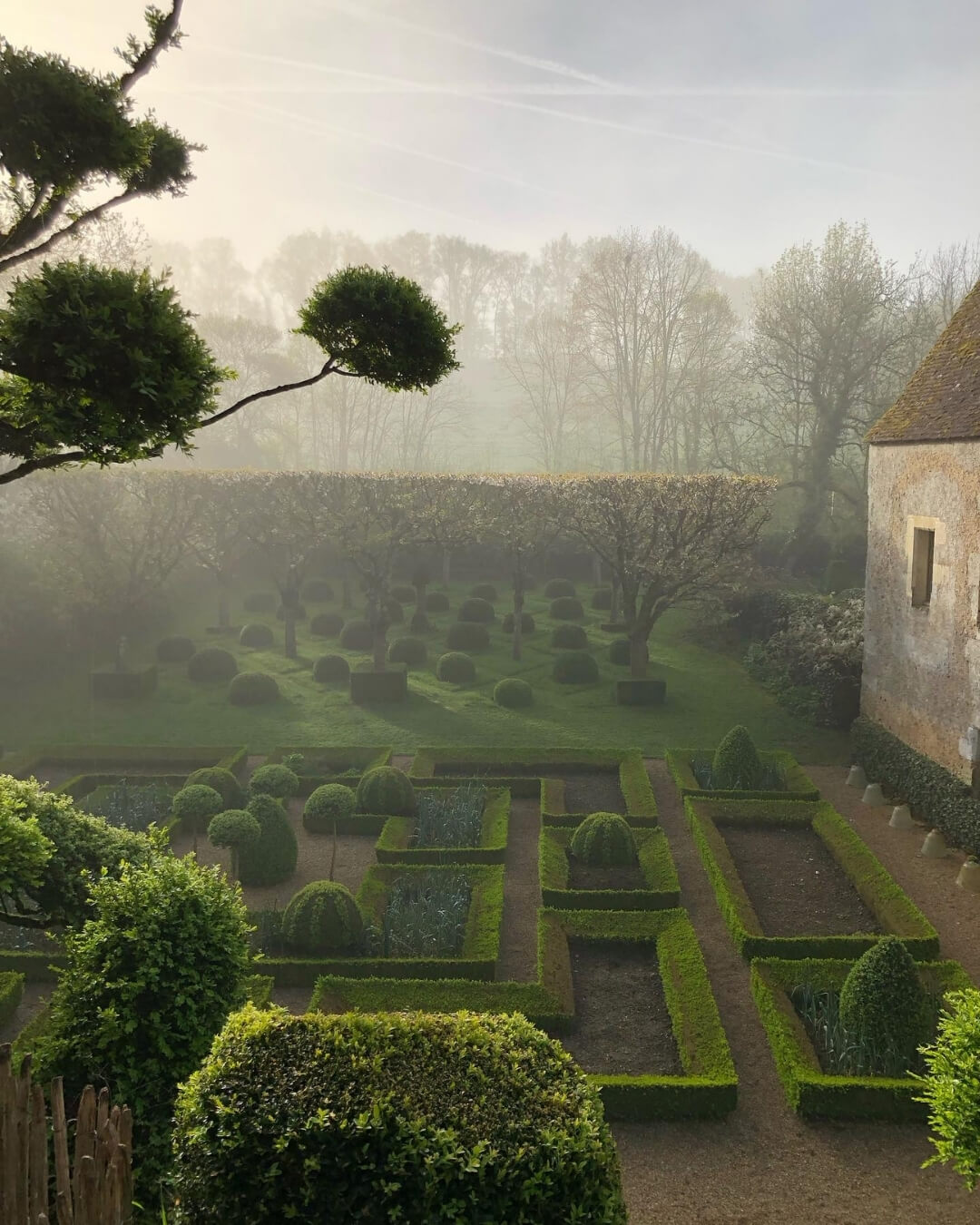 Prieuré de Vauboin topiary garden in Beaumont-sur-Dême, France with manicured geometric hedges.
