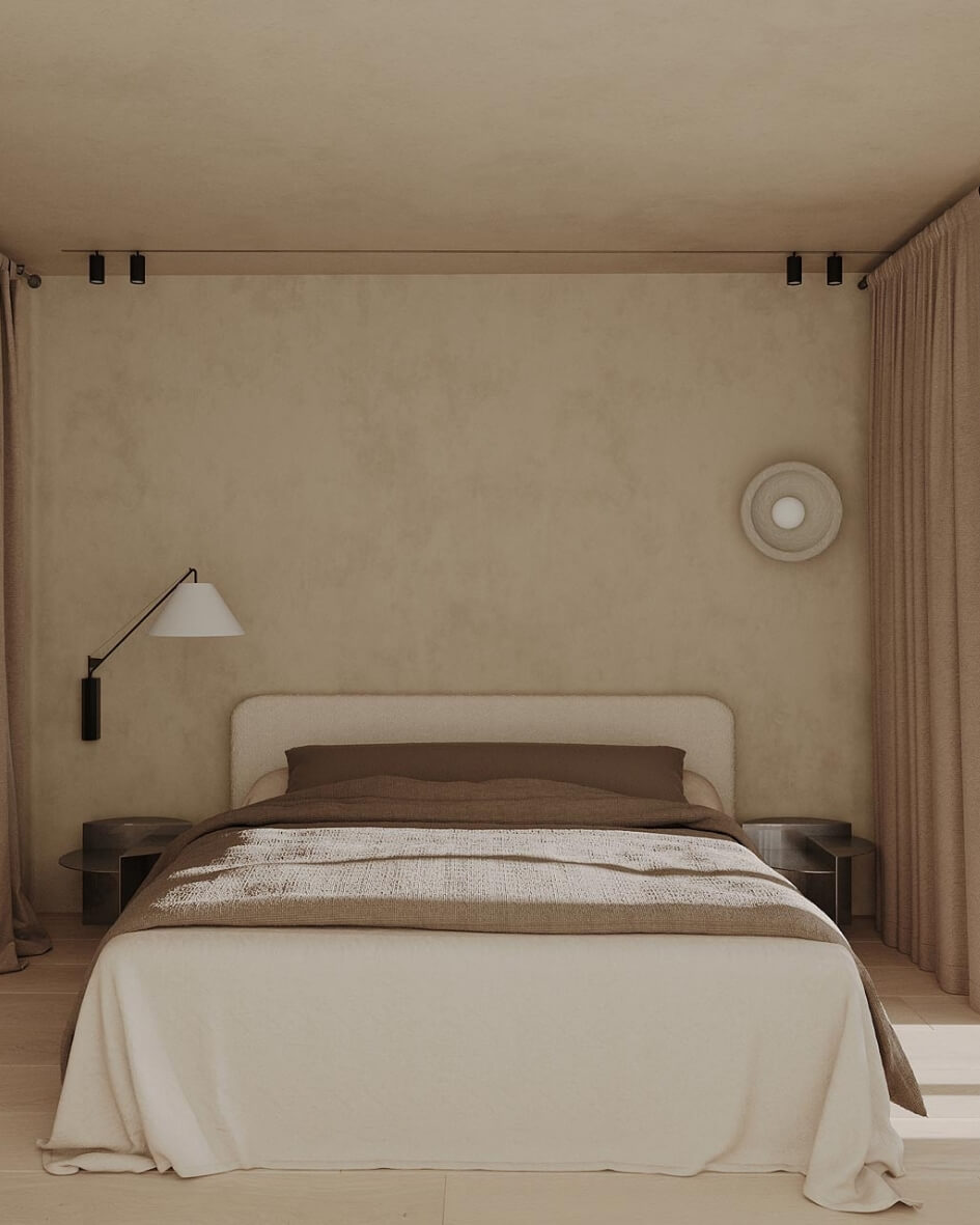 Interior of the Rose Nordelaia boutique hotel featuring minimalist design, soft natural light, and cozy bedding.