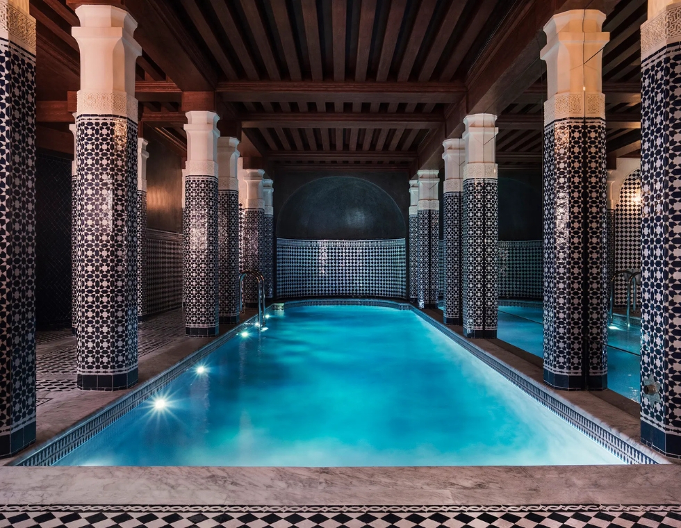 La Mer Spa at Maison Proust in Paris with Moroccan tile columns along a luxury indoor swimming pool.
