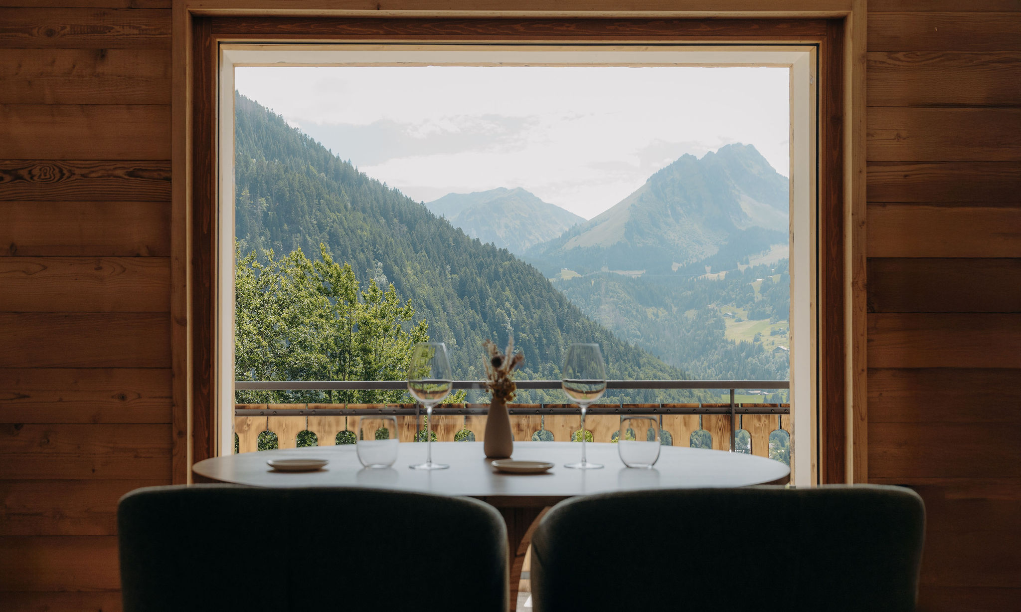 Green mountain view from Michelin Star Chalet Flachaire restaurant along the French Alps.