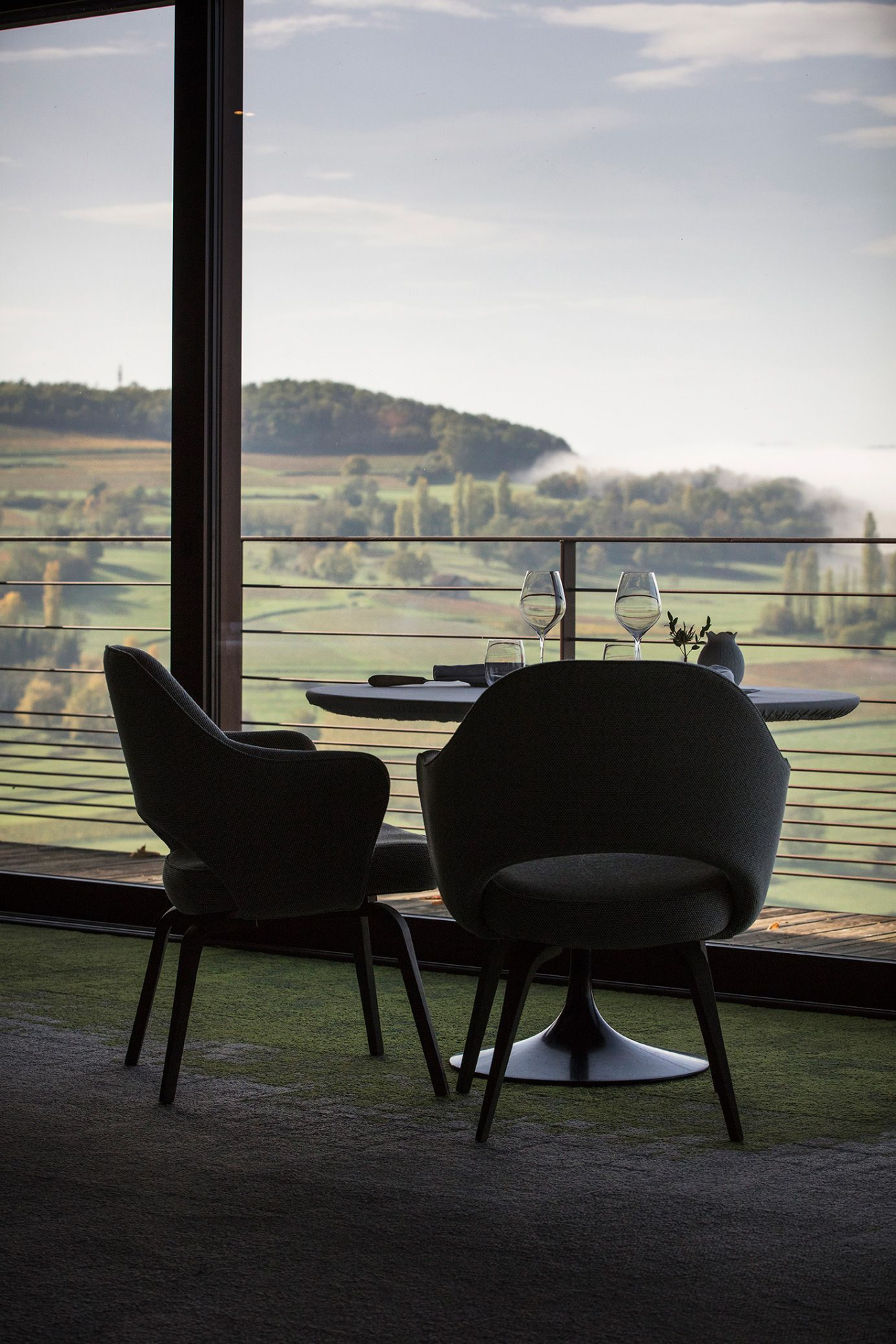 Restaurant Les Morainières luxury dining with a view overlooking the lush French countryside.