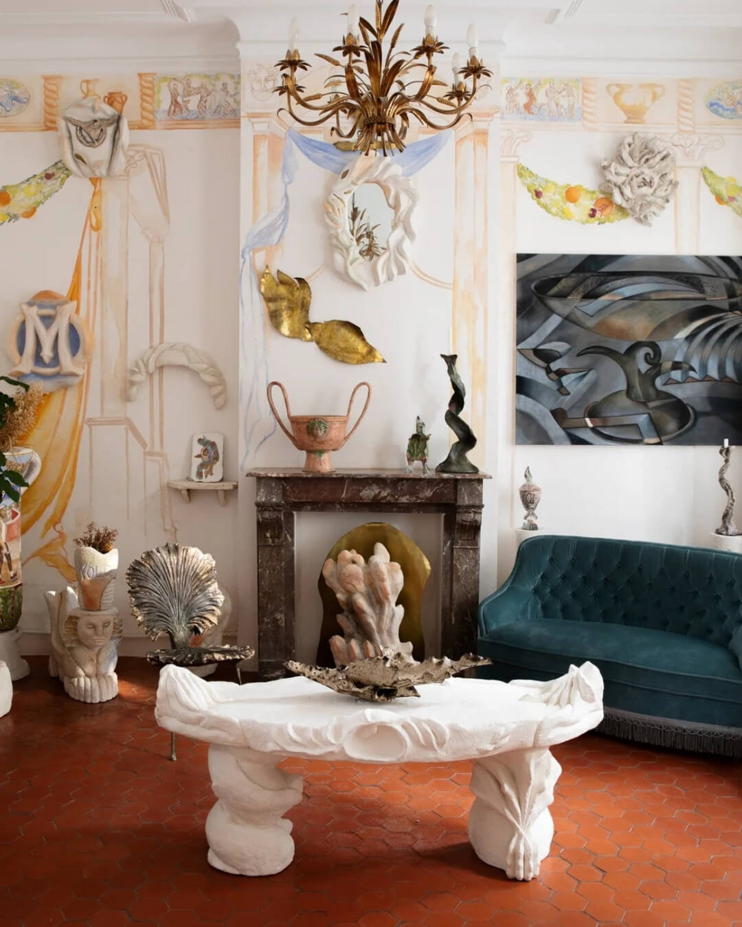Salon interior at Pavillion Southway in Marseille with sculptural furniture, patterned textiles, and painted wall details.