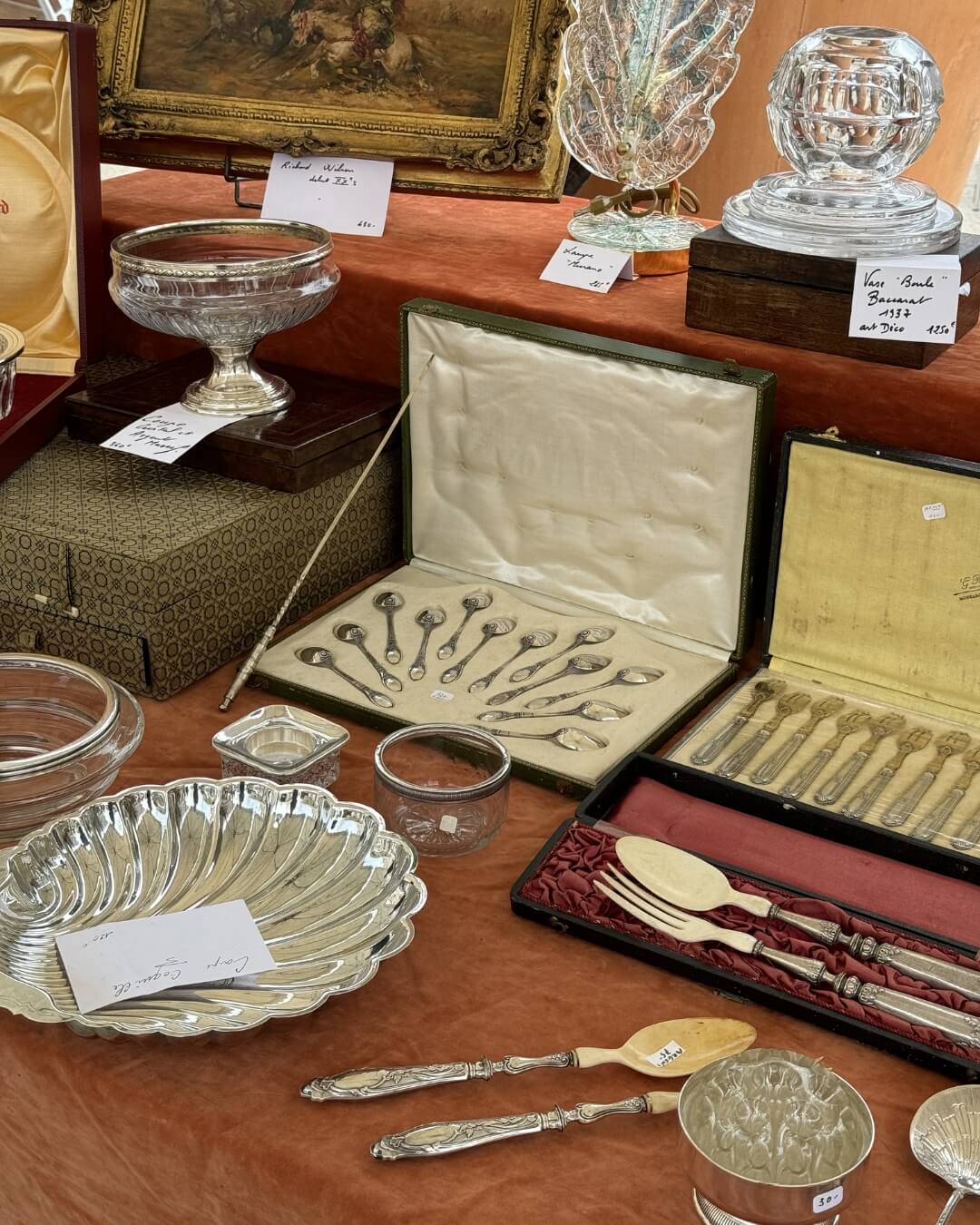 French antique cutlery with silver dessert spoons and bone salad servers in velvet boxes.