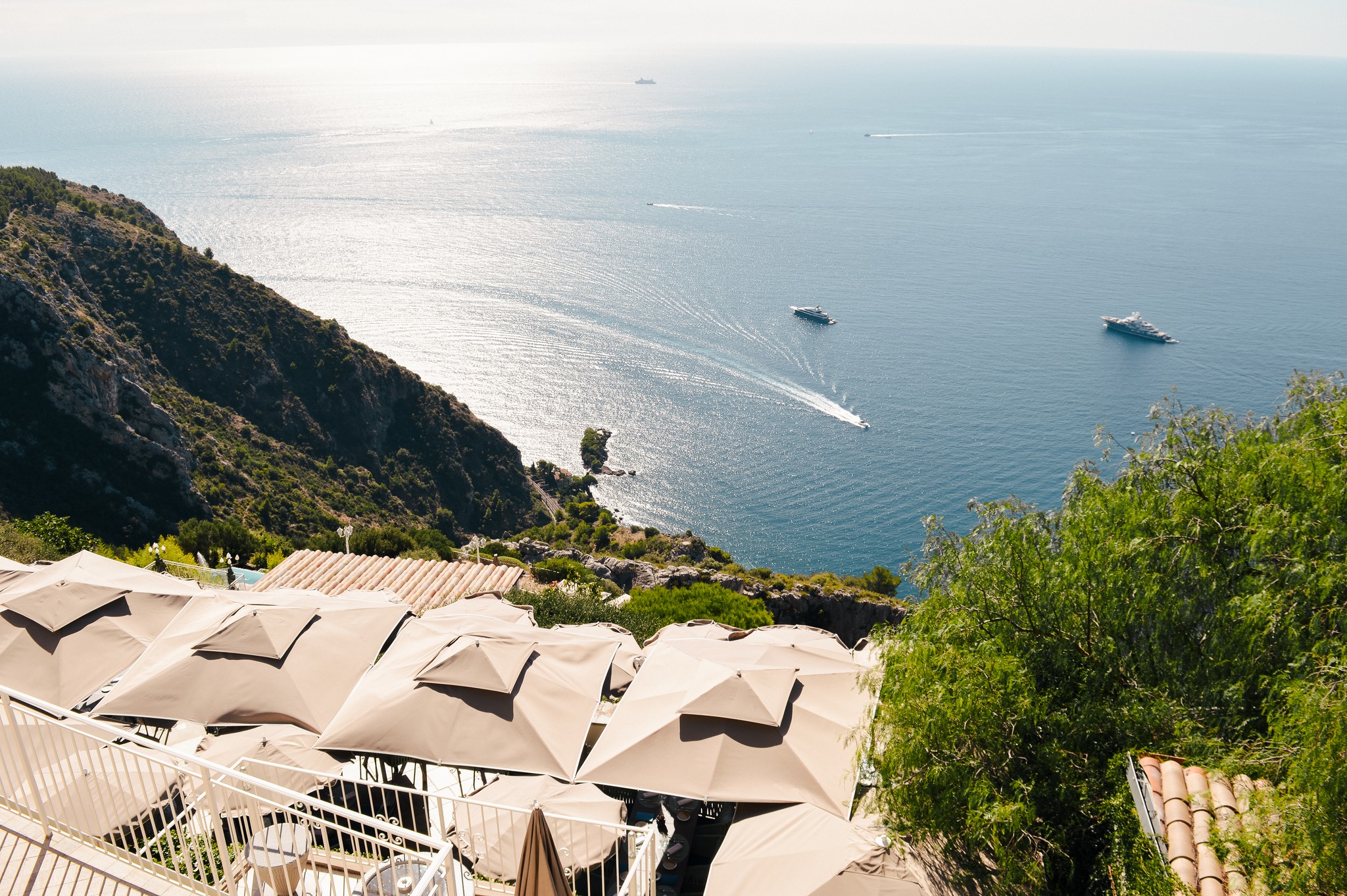 Lush cliffside view of Eze and the Mediterranean Sea from Les Ramparts restaurant.