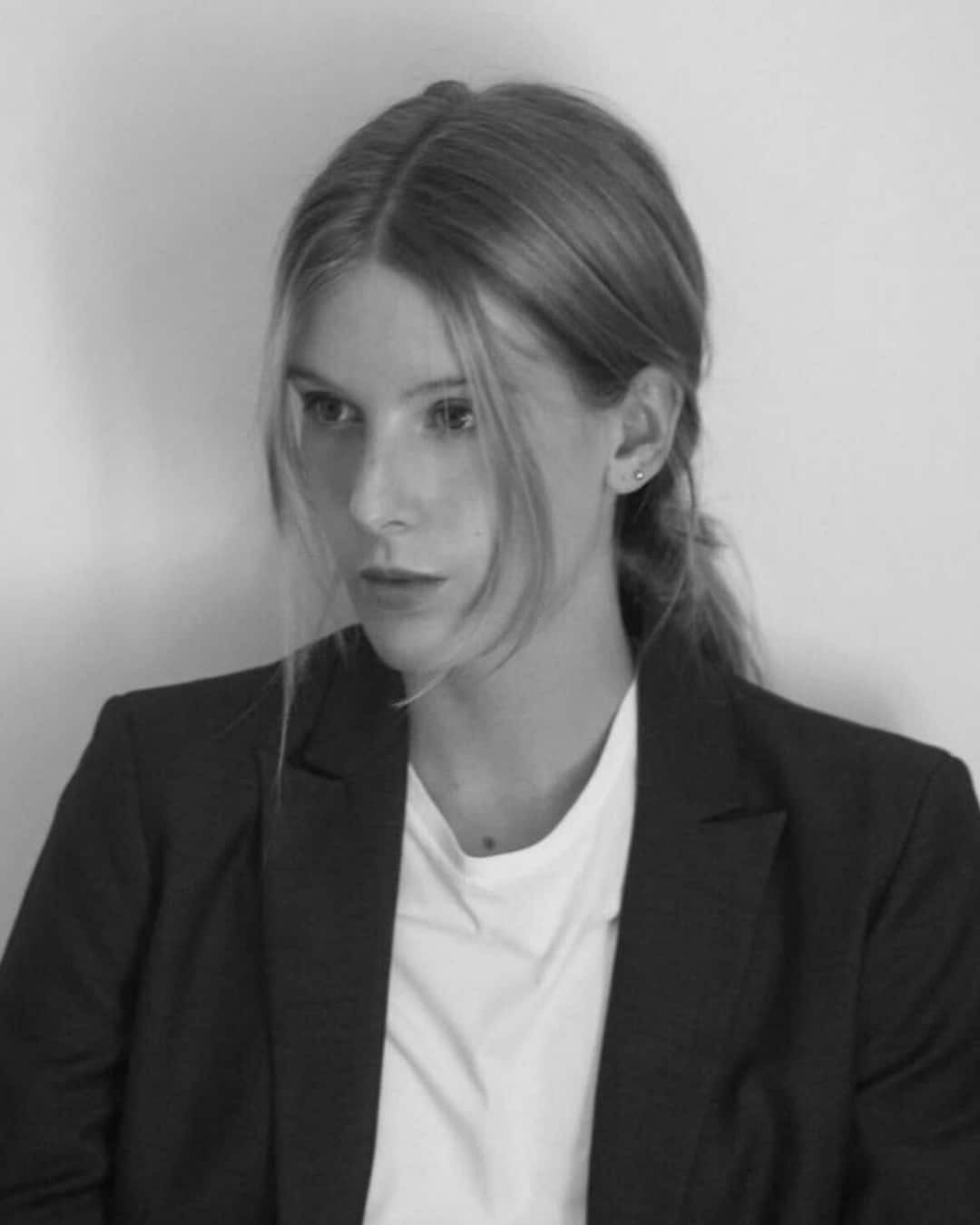 Alizée Baudoin in a white shirt and black blazer.