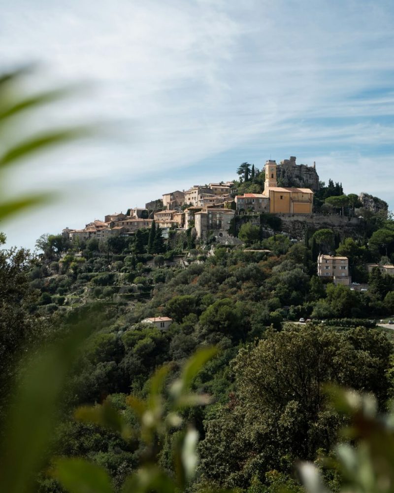 Historic French village in the French Riviera, surrounded by lush natural greenery.