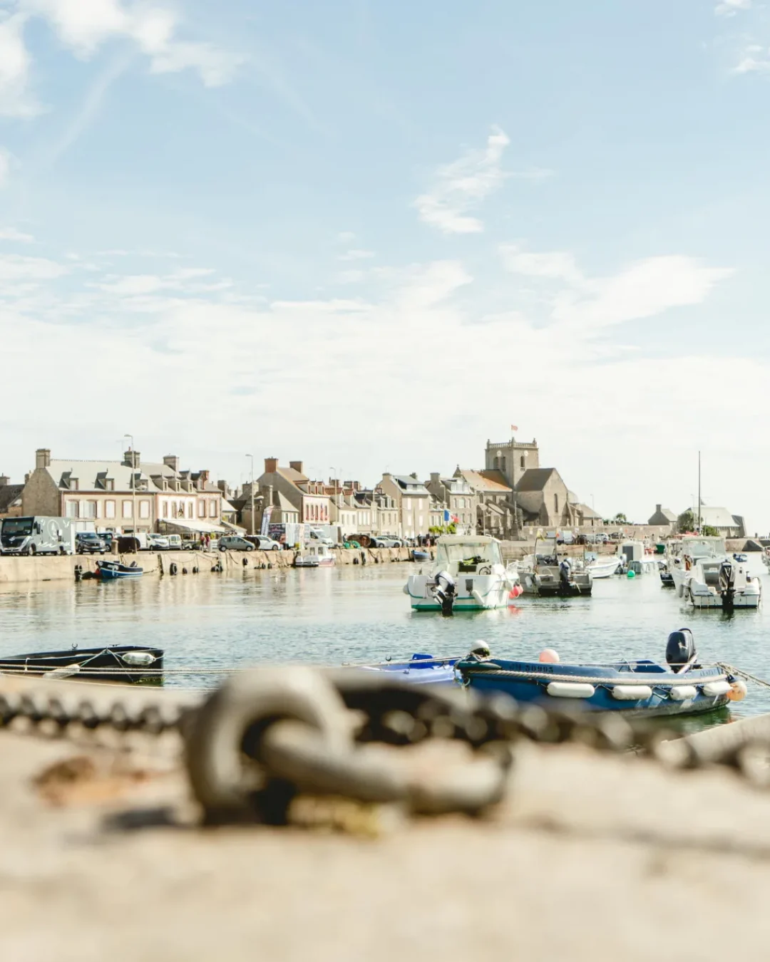Barfleur port in Normandy, France with moored fishing boats.